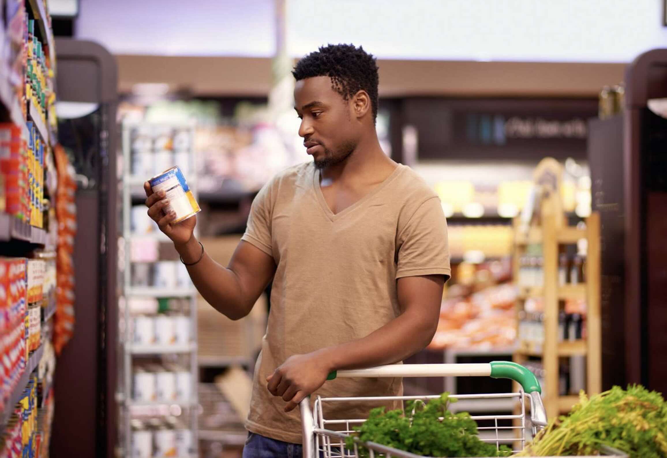 Shopping cart with groceries representing consumer spending trends